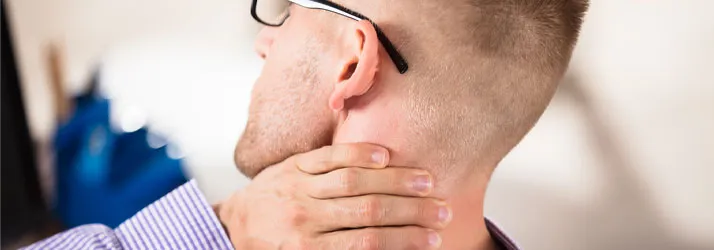 A person experiencing neck pain