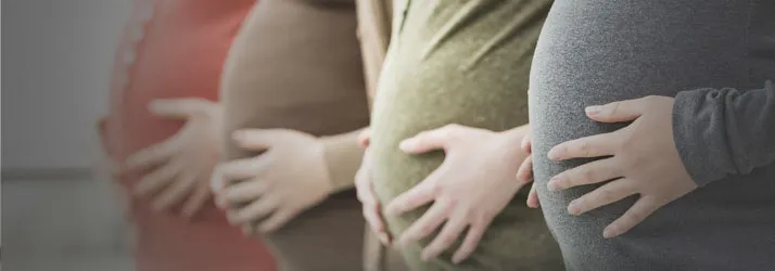 Expecting mothers holding their bellies