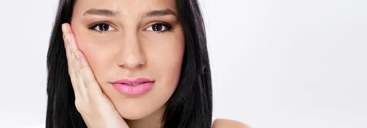 Woman experiencing jaw discomfort